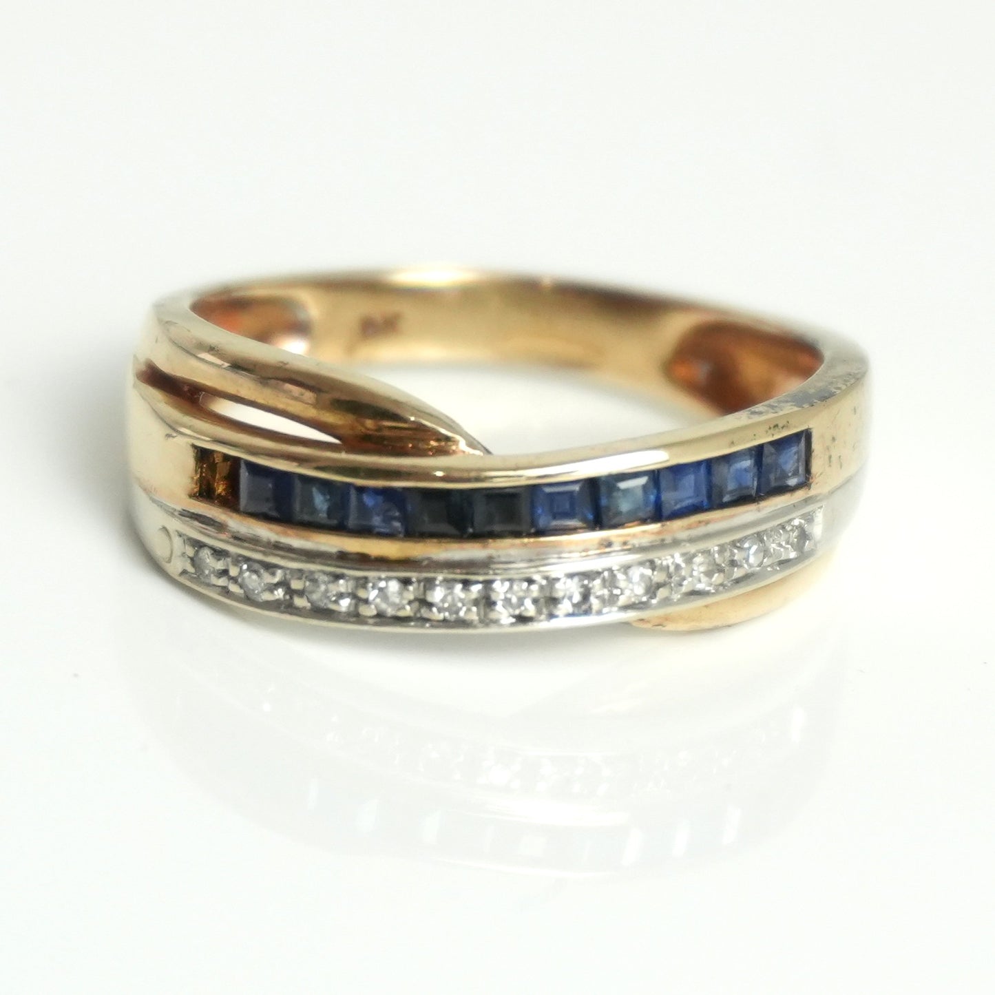 Diamond and sapphire channel style ring, featuring 0.55 carats of sapphires and 0.07carats of diamonds.