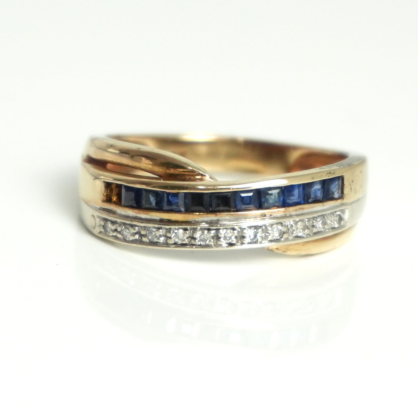 Diamond and sapphire channel style ring, featuring 0.55 carats of sapphires and 0.07carats of diamonds.