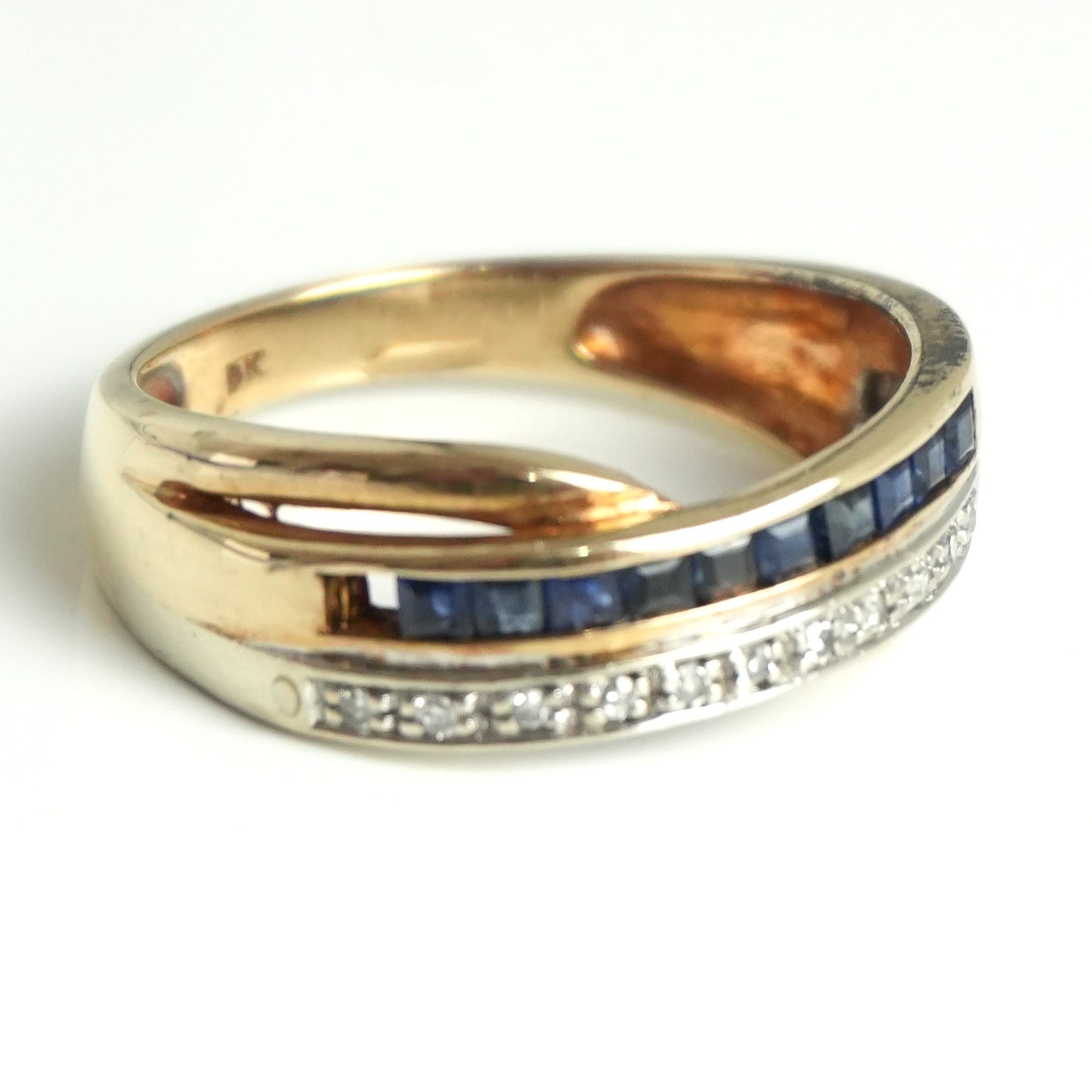 Diamond and sapphire channel style ring, featuring 0.55 carats of sapphires and 0.07carats of diamonds.