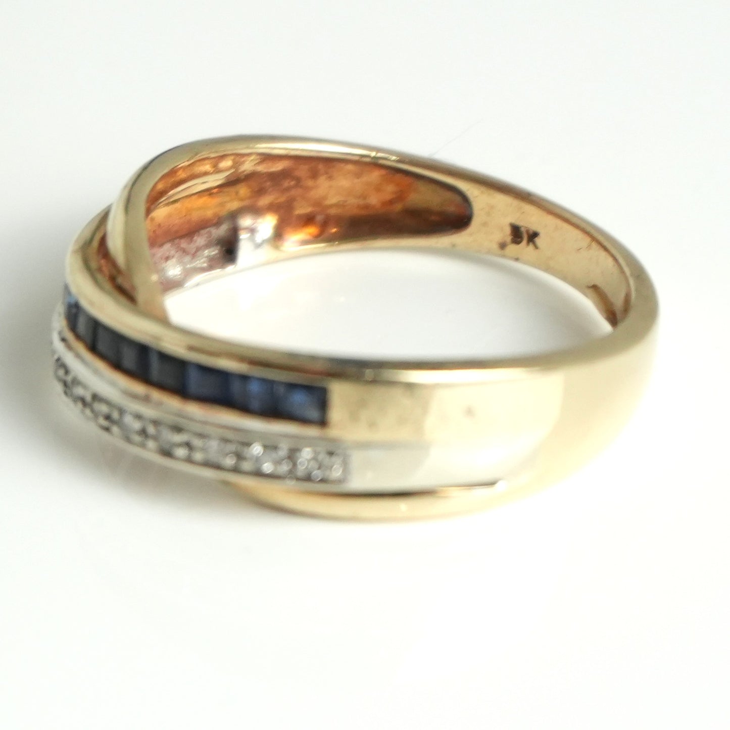 Diamond and sapphire channel style ring, featuring 0.55 carats of sapphires and 0.07carats of diamonds.